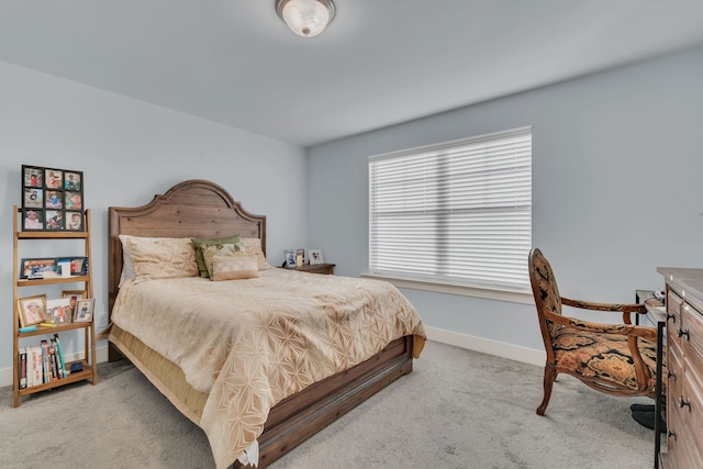 bedroom featuring light carpet