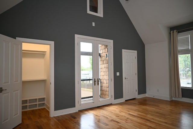 entryway featuring hardwood / wood-style flooring, a wealth of natural light, and french doors