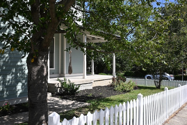 view of property exterior with a porch