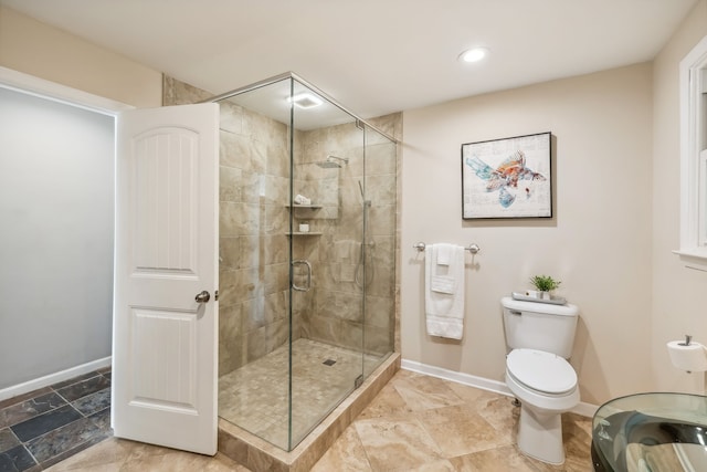 bathroom featuring toilet and walk in shower