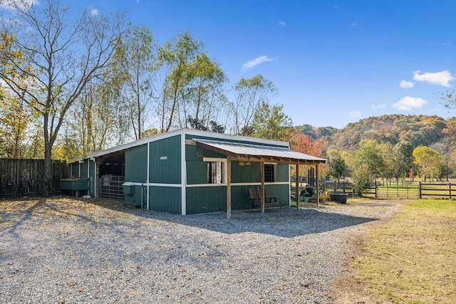 exterior space with a mountain view and an outdoor structure