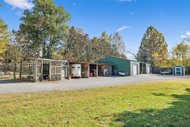 view of outbuilding featuring a yard