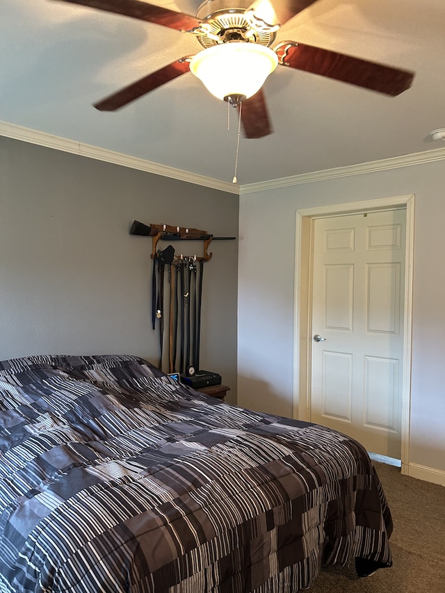 carpeted bedroom with ornamental molding and ceiling fan