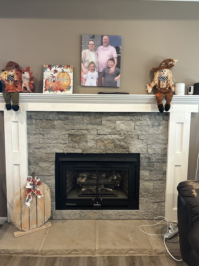 room details featuring hardwood / wood-style floors and a fireplace