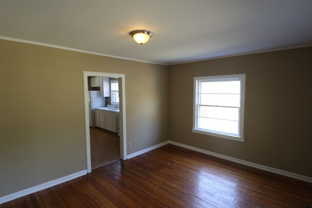 304 Mitchell St, Clarksville, TN 37042 - empty room with baseboards, crown molding, and dark wood-type flooring