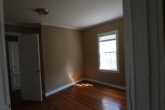 304 Mitchell St, Clarksville, TN 37042 - spare room with dark wood-type flooring, baseboards, visible vents, and ornamental molding