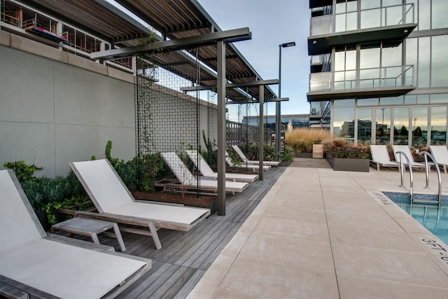 view of patio featuring a community pool