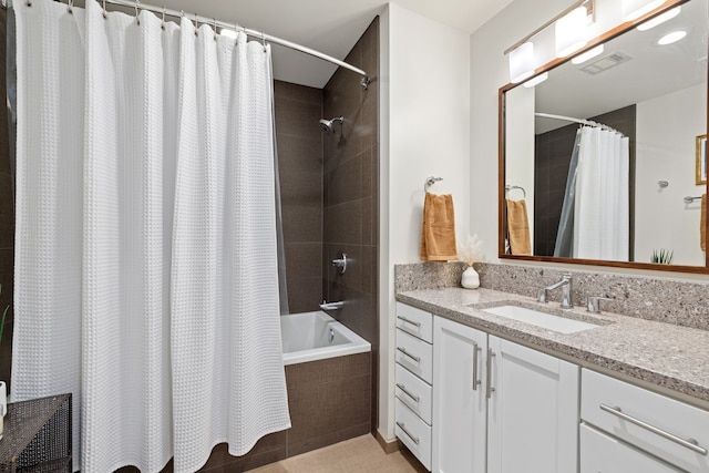 bathroom with vanity, shower / tub combo, and tile patterned flooring