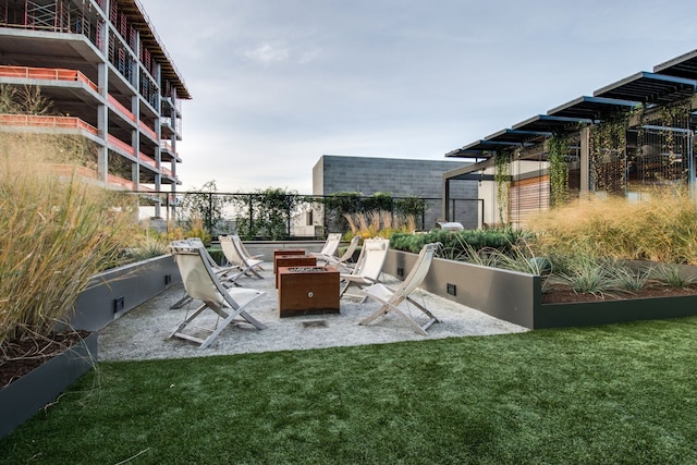 view of patio / terrace with an outdoor fire pit