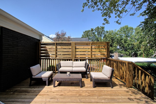 wooden terrace featuring outdoor lounge area