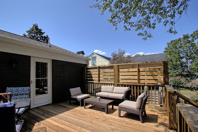 wooden terrace featuring outdoor lounge area