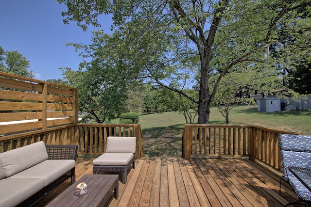 wooden terrace with a storage unit, a lawn, and an outdoor hangout area