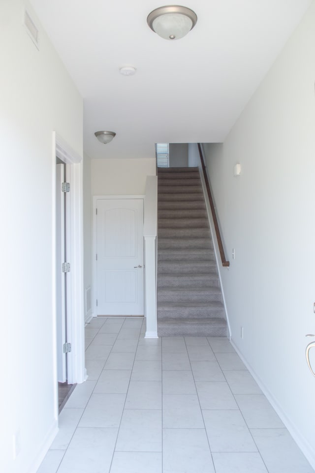 staircase with tile patterned flooring