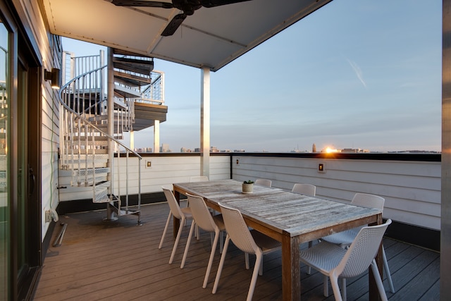 deck at dusk with ceiling fan