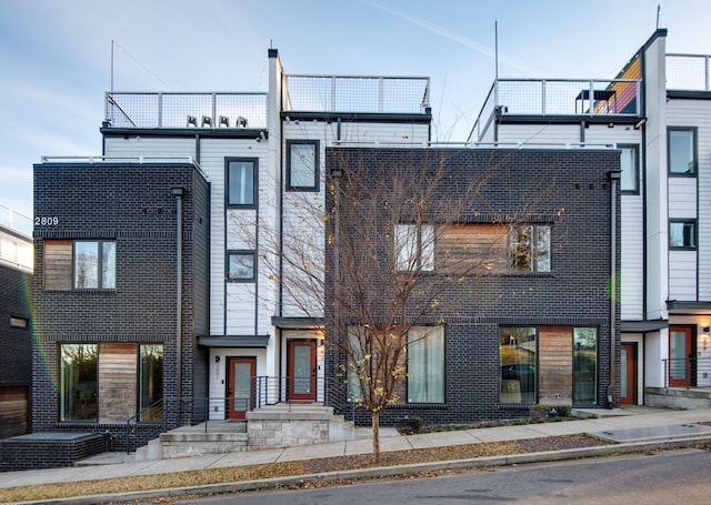 view of front of house featuring a balcony