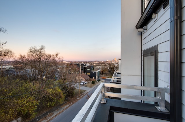 view of balcony at dusk