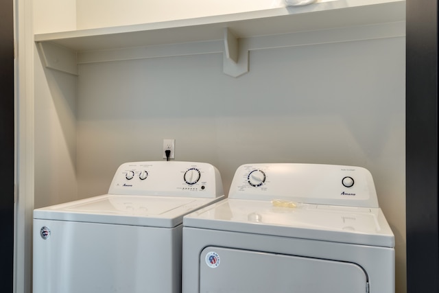 washroom featuring washer and clothes dryer