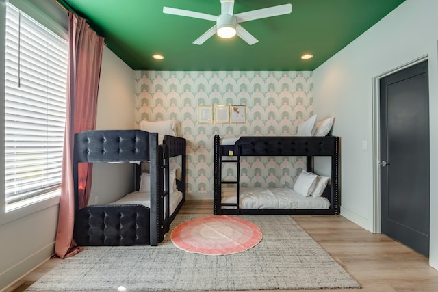 bedroom featuring light hardwood / wood-style flooring and ceiling fan