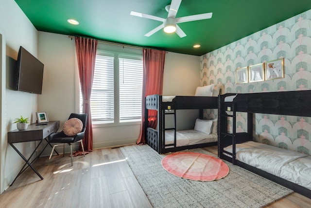 bedroom featuring light hardwood / wood-style floors and ceiling fan