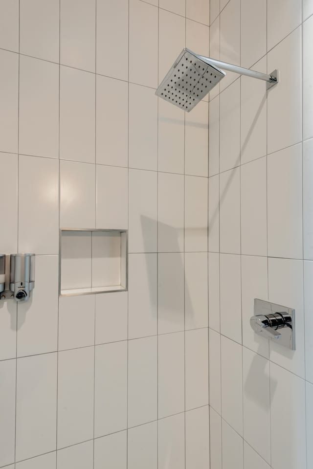 bathroom with a tile shower