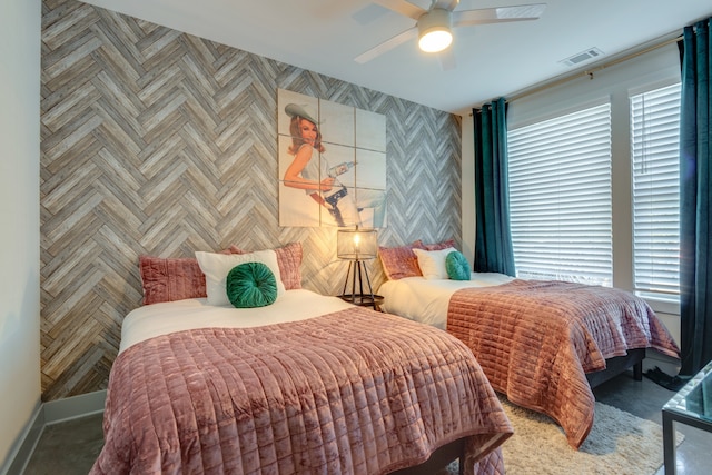 bedroom featuring multiple windows and ceiling fan