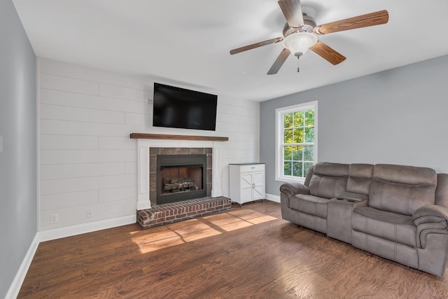 living room with hardwood / wood-style flooring and ceiling fan