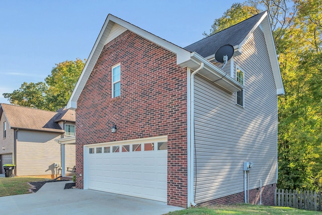 view of side of property with a garage