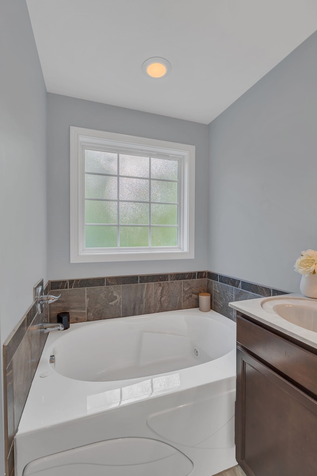 bathroom featuring vanity and a bathtub