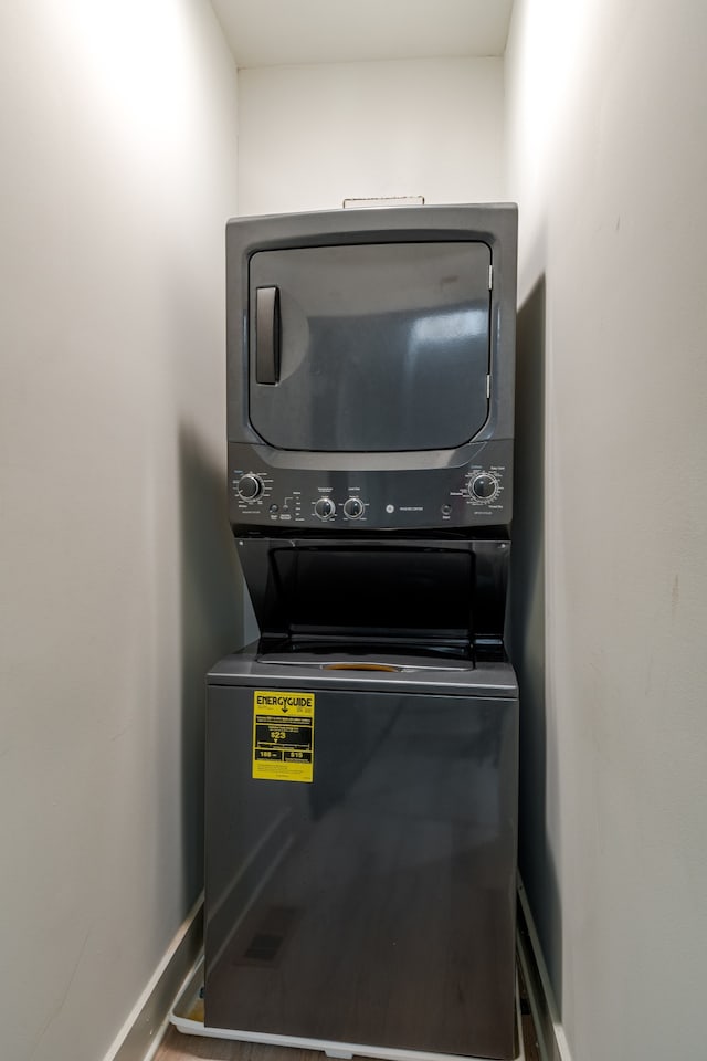 laundry area featuring stacked washer and clothes dryer