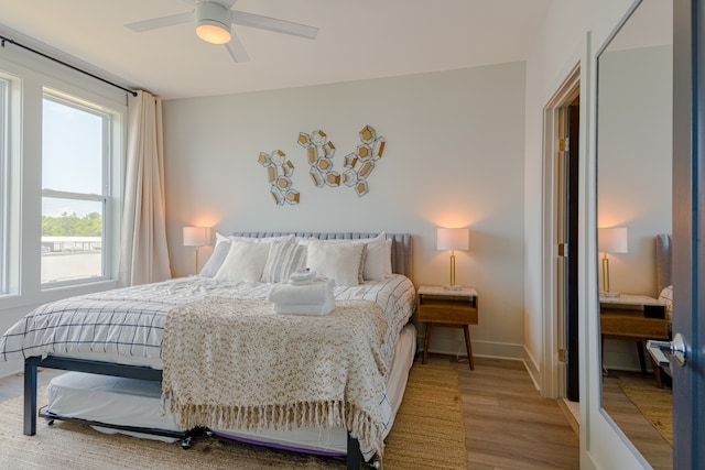 bedroom featuring hardwood / wood-style flooring and ceiling fan