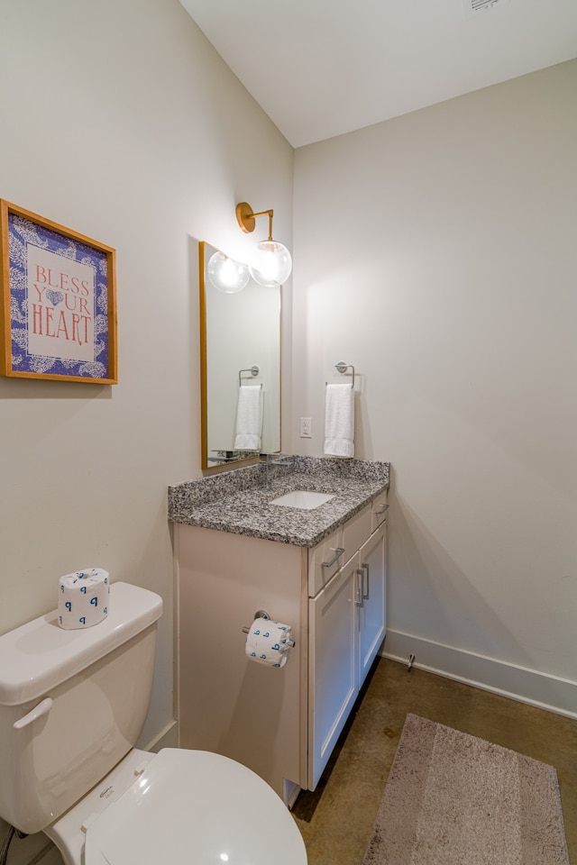 bathroom with vanity and toilet