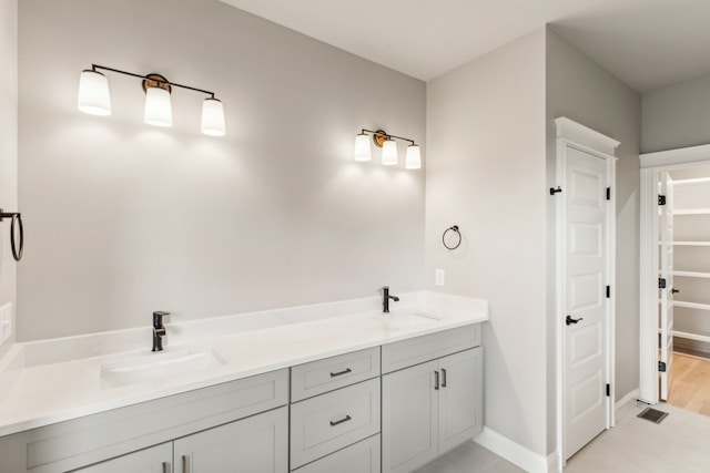 bathroom with vanity and tile patterned floors