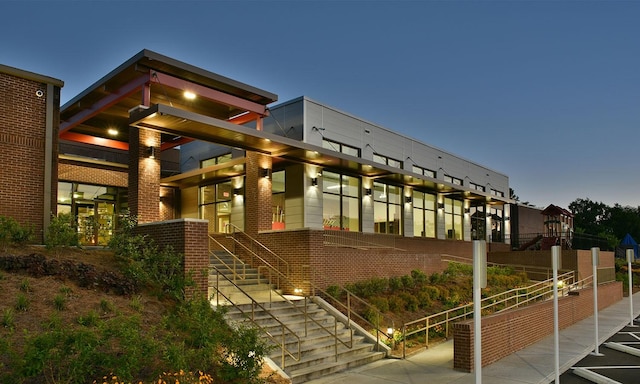 view of outdoor building at dusk