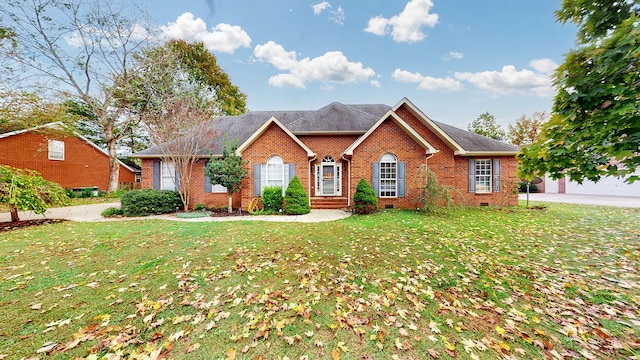 view of front facade with a front yard and a garage