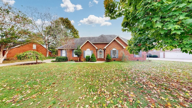 view of front of property with a front lawn and a garage