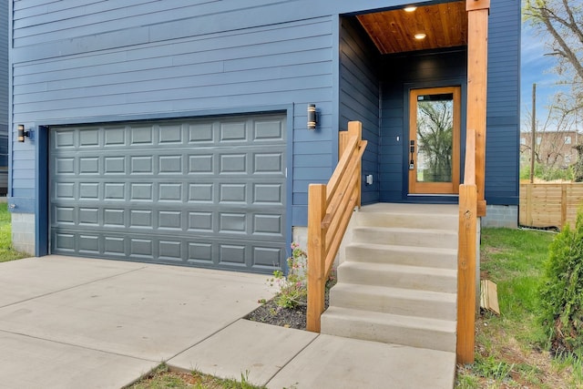 doorway to property with a garage