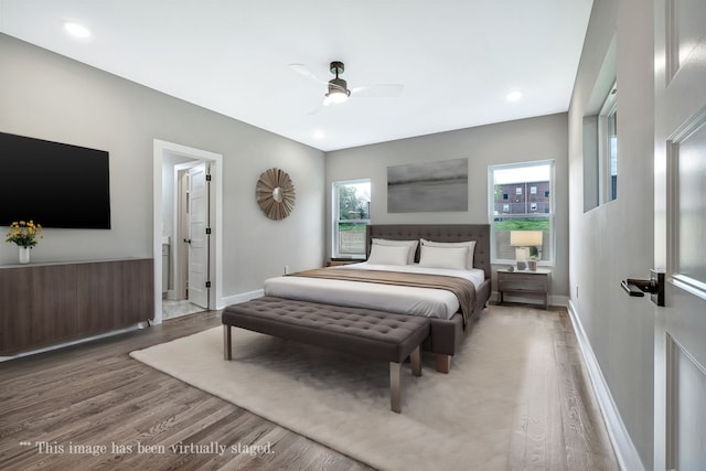 bedroom with hardwood / wood-style floors and ceiling fan