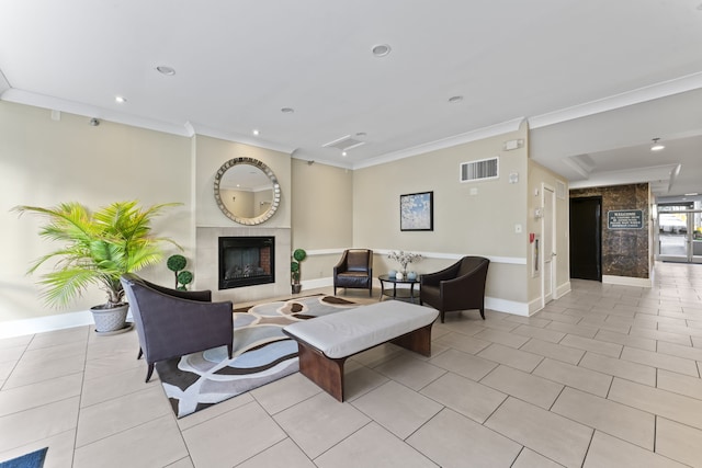 tiled living room with crown molding and a tiled fireplace