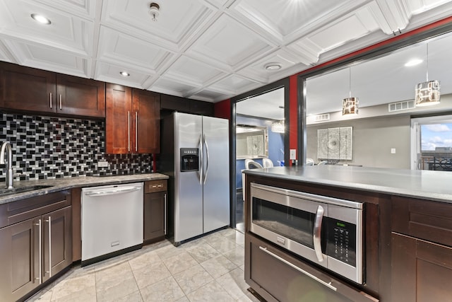 kitchen featuring sink, hanging light fixtures, stainless steel appliances, coffered ceiling, and backsplash