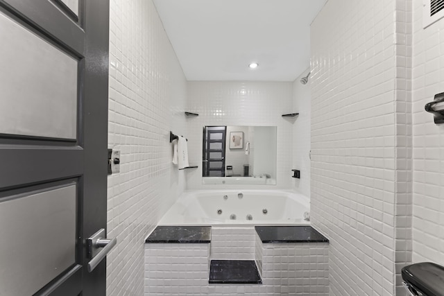 bathroom featuring a tub to relax in