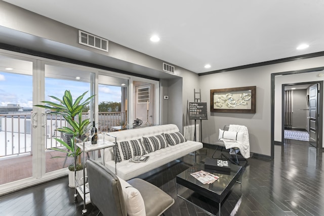 living room featuring dark hardwood / wood-style flooring and crown molding