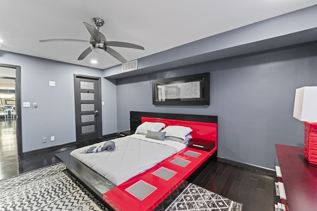 bedroom featuring ceiling fan and dark wood-type flooring