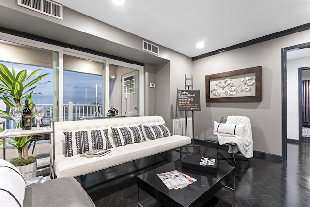 living room featuring dark hardwood / wood-style flooring and ornamental molding