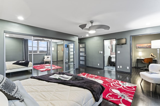 bedroom featuring ceiling fan, a closet, and dark wood-type flooring