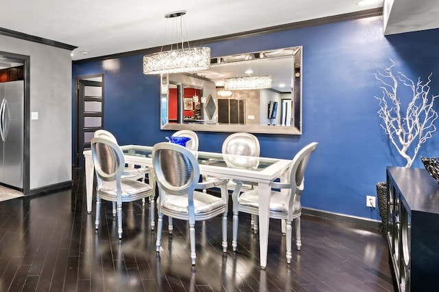 dining area with hardwood / wood-style floors and ornamental molding