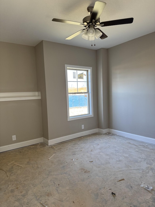 unfurnished room featuring concrete floors and ceiling fan