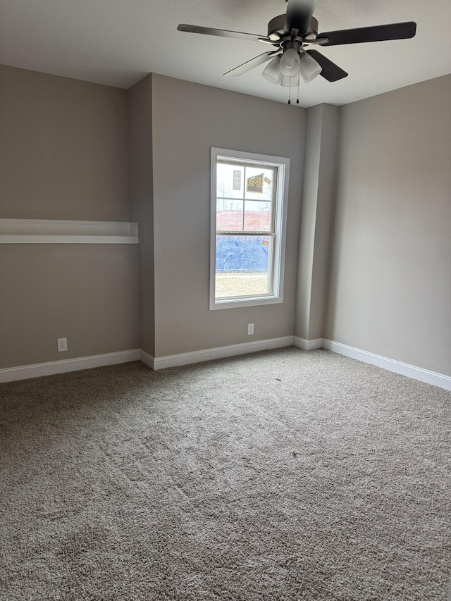 empty room featuring carpet and ceiling fan