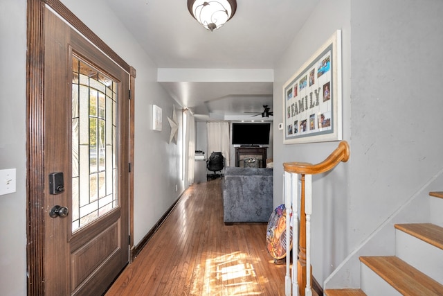 foyer entrance featuring hardwood / wood-style floors and ceiling fan