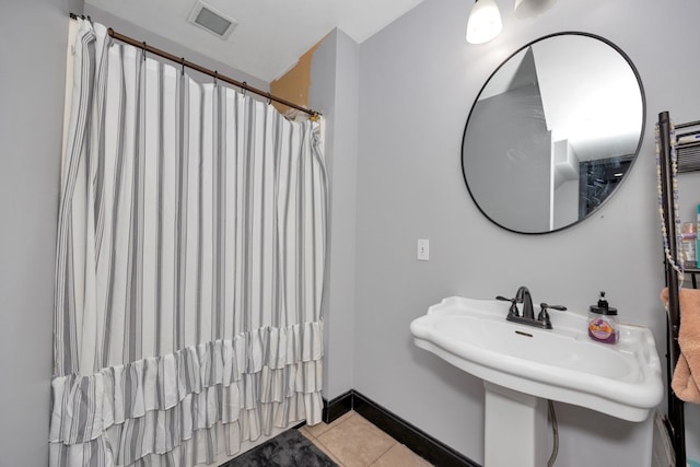 bathroom featuring tile patterned flooring