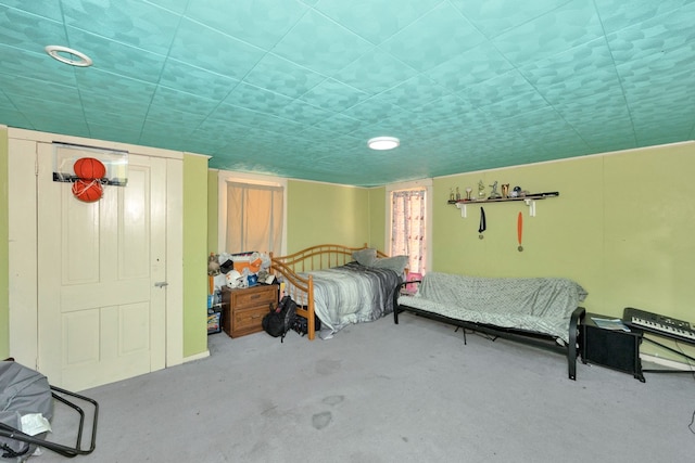 bedroom featuring concrete floors